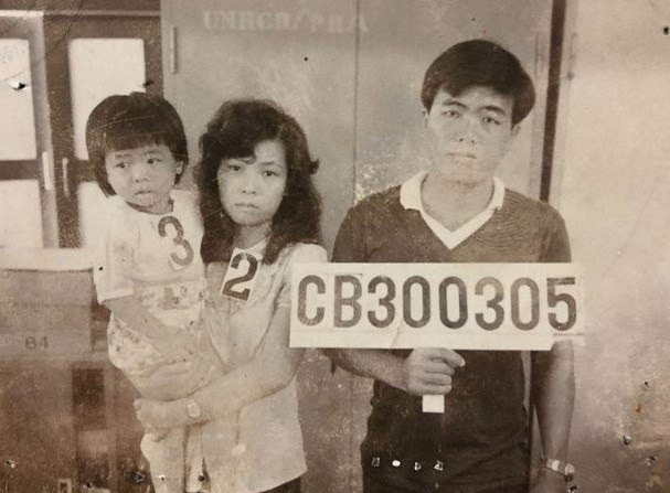 A photo of Cheng's parents and older brother at a refugee camp in Thailand in 1985.